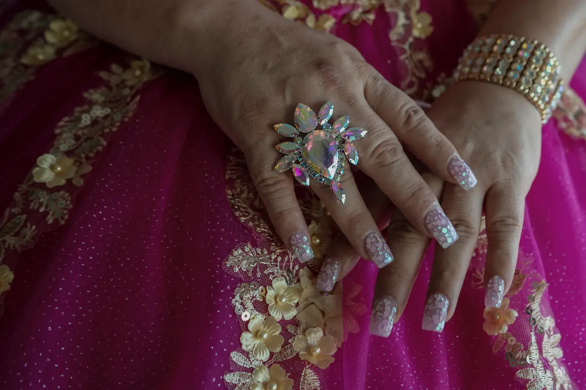 Kassandra-Rivas-51-poses-for-a-photo-in-her-quinceanera-dress-at-a-hotel-in-Houston-Texas-U-S-May-14-2025-Rivas-and-other-transgender-Latina-immigrants-were-recently-able-to-celebrate-this-year-as-quinceaneras-thanks-to-the-Organizacion-Latina-de-Trans-en-Texas-a-group-promoting-rights-for-LGBTQ-people-including-transgender-women-from-Latin-America-Something-inside-me-held-a-longing-to-experience-this-moment-as-a-girl-as-a-15-year-old-Rivas-said-I-imagined-myself-standing-before-the-priest-in-church-wearing-a-dress-like-any-other-woman-REUTERS-Gabriel-V-Cardenas-SEARCH-CARDENAS-U-S-QUINCEANERAS-FOR-THIS-STORY-SEARCH-WIDER-IMAGE-FOR-ALL-STORIES-THIS-IMAGE-IS-ONLY-FOR-USE-WITH-THE-STORY-USA-LGBTQ-QUINCEANERAS-NO-STANDALONE-USES