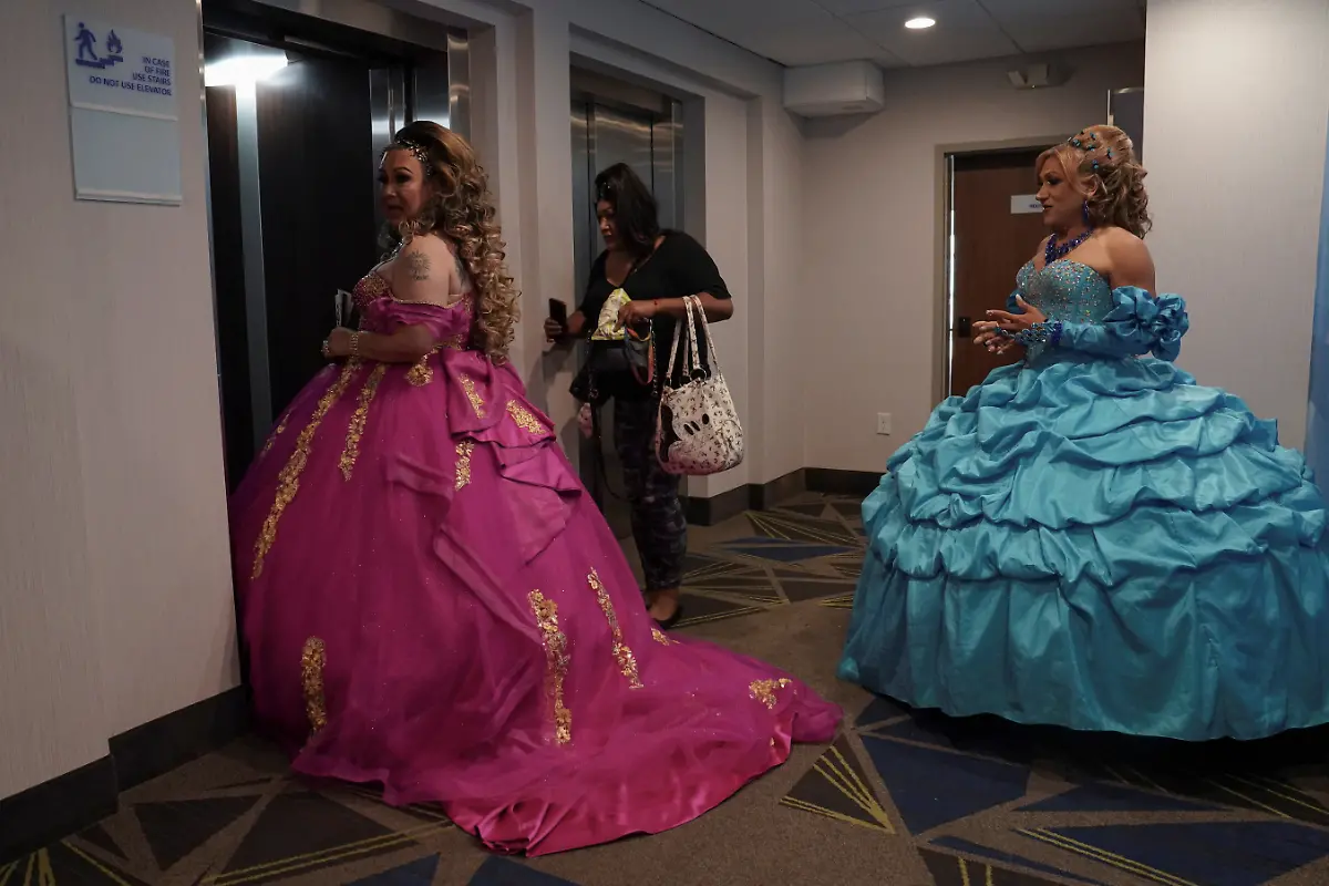 From-left-to-right-Kassandra-Rivas-51-Marlen-Vazquez-and-Vickymar-Castrellon-54-make-their-way-to-the-elevator-at-a-hotel-in-Houston-Texas-U-S-May-14-2025-Rivas-and-other-transgender-Latina-immigrants-were-recently-able-to-celebrate-this-year-as-quinceaneras-thanks-to-the-Organizacion-Latina-de-Trans-en-Texas-a-group-promoting-rights-for-LGBTQ-people-including-transgender-women-from-Latin-America-Something-inside-me-held-a-longing-to-experience-this-moment-as-a-girl-as-a-15-year-old-Rivas-said-I-imagined-myself-standing-before-the-priest-in-church-wearing-a-dress-like-any-other-woman-REUTERS-Gabriel-V-Cardenas-SEARCH-CARDENAS-U-S-QUINCEANERAS-FOR-THIS-STORY-SEARCH-WIDER-IMAGE-FOR-ALL-STORIES-THIS-IMAGE-IS-ONLY-FOR-USE-WITH-THE-STORY-USA-LGBTQ-QUINCEANERAS-NO-STANDALONE-USES