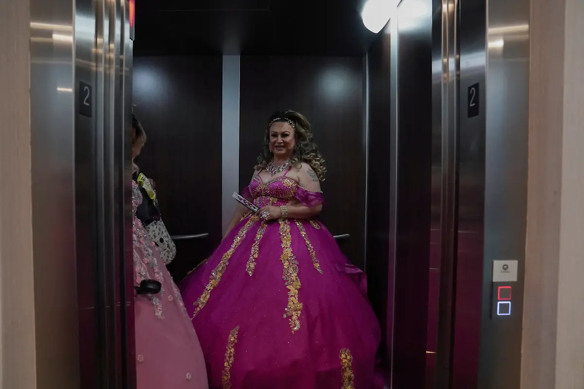Kassandra-Rivas-51-and-Noemi-Martinez-54-wait-at-the-elevator-at-a-hotel-in-Houston-Texas-U-S-May-14-2025-Rivas-Martinez-and-other-transgender-Latina-immigrants-were-recently-able-to-celebrate-this-year-as-quinceaneras-thanks-to-the-Organizacion-Latina-de-Trans-en-Texas-a-group-promoting-rights-for-LGBTQ-people-including-transgender-women-from-Latin-America-Something-inside-me-held-a-longing-to-experience-this-moment-as-a-girl-as-a-15-year-old-Rivas-said-I-imagined-myself-standing-before-the-priest-in-church-wearing-a-dress-like-any-other-woman-REUTERS-Gabriel-V-Cardenas-SEARCH-CARDENAS-U-S-QUINCEANERAS-FOR-THIS-STORY-SEARCH-WIDER-IMAGE-FOR-ALL-STORIES-THIS-IMAGE-IS-ONLY-FOR-USE-WITH-THE-STORY-USA-LGBTQ-QUINCEANERAS-NO-STANDALONE-USES