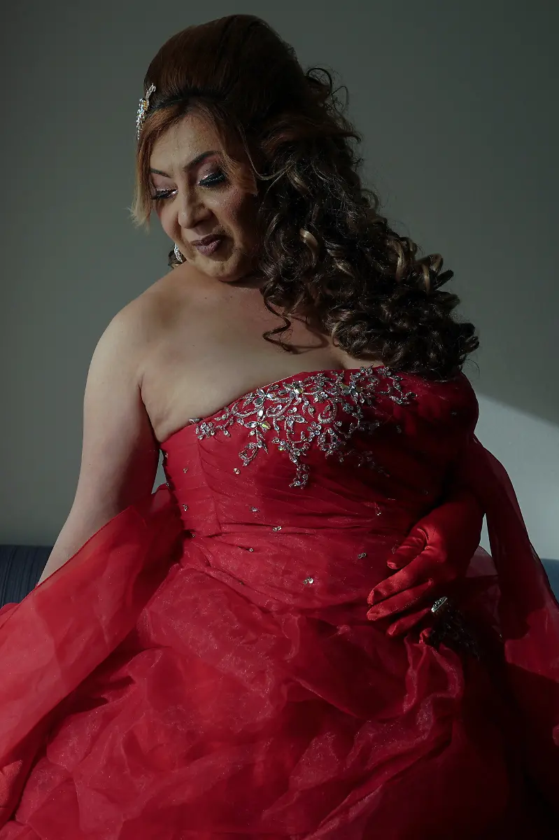 Dilian-Quijano-58-poses-for-a-photo-at-a-hotel-in-Houston-Texas-U-S-May-14-2025-Quijano-and-other-transgender-Latina-immigrants-were-recently-able-to-celebrate-this-year-as-quinceaneras-literally-translated-as-15-year-olds-thanks-to-the-Organizacion-Latina-de-Trans-en-Texas-a-group-promoting-rights-for-LGBTQ-people-including-transgender-women-from-Latin-America-I-would-see-them-quinceaneras-wear-beautiful-dresses-I-would-see-the-long-dress-and-them-dancing-and-I-would-say-to-myself-How-beautiful-I-would-like-to-have-a-dress-like-that-someday-but-I-never-thought-that-that-would-become-true-Quijano-said-REUTERS-Gabriel-V-Cardenas-SEARCH-CARDENAS-U-S-QUINCEANERAS-FOR-THIS-STORY-SEARCH-WIDER-IMAGE-FOR-ALL-STORIES-THIS-IMAGE-IS-ONLY-FOR-USE-WITH-THE-STORY-USA-LGBTQ-QUINCEANERAS-NO-STANDALONE-USES