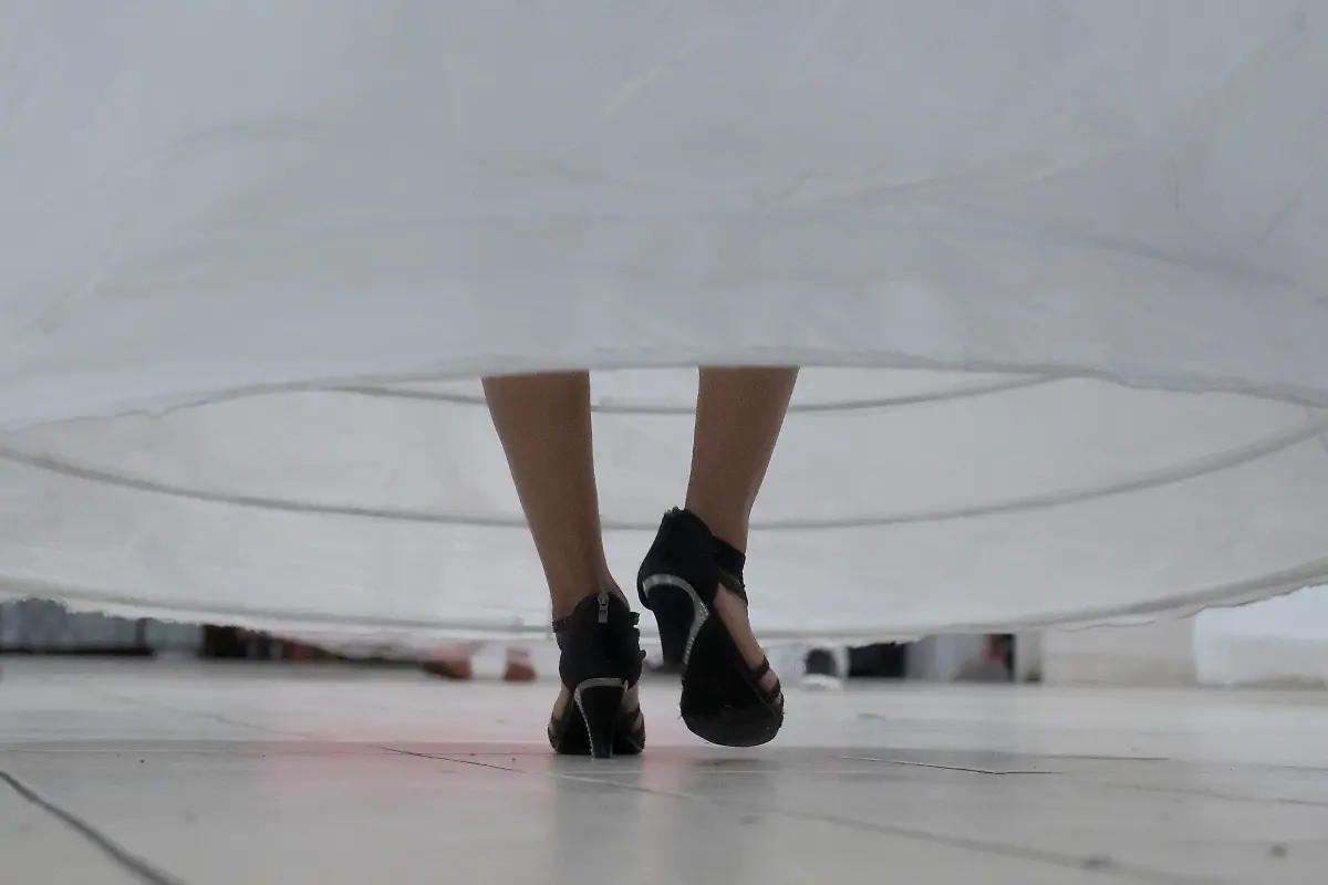 Vickymar-Castrellon-54-dances-to-Tiempo-de-Vals-by-Chayanne-during-the-rehearsal-at-a-ballroom-in-Houston-Texas-U-S-May-13-2025-Castrellon-and-other-transgender-Latina-immigrants-were-recently-able-to-celebrate-this-year-as-quinceaneras-literally-translated-as-15-year-olds-thanks-to-the-Organizacion-Latina-de-Trans-en-Texas-a-group-promoting-rights-for-LGBTQ-people-including-transgender-women-from-Latin-America-I-never-thought-I-d-get-to-my-50s-said-Castrellon-who-would-sometimes-as-a-teenager-wear-her-friends-quinceanera-gowns-and-pretend-to-be-the-girl-of-honor-It-s-a-dream-I-ve-always-had-and-I-feel-very-happy-because-achieving-it-before-I-leave-this-world-is-something-very-beautiful-for-me-REUTERS-Gabriel-V-Cardenas-SEARCH-CARDENAS-U-S-QUINCEANERAS-FOR-THIS-STORY-SEARCH-WIDER-IMAGE-FOR-ALL-STORIES-THIS-IMAGE-IS-ONLY-FOR-USE-WITH-THE-STORY-USA-LGBTQ-QUINCEANERAS-NO-STANDALONE-USES