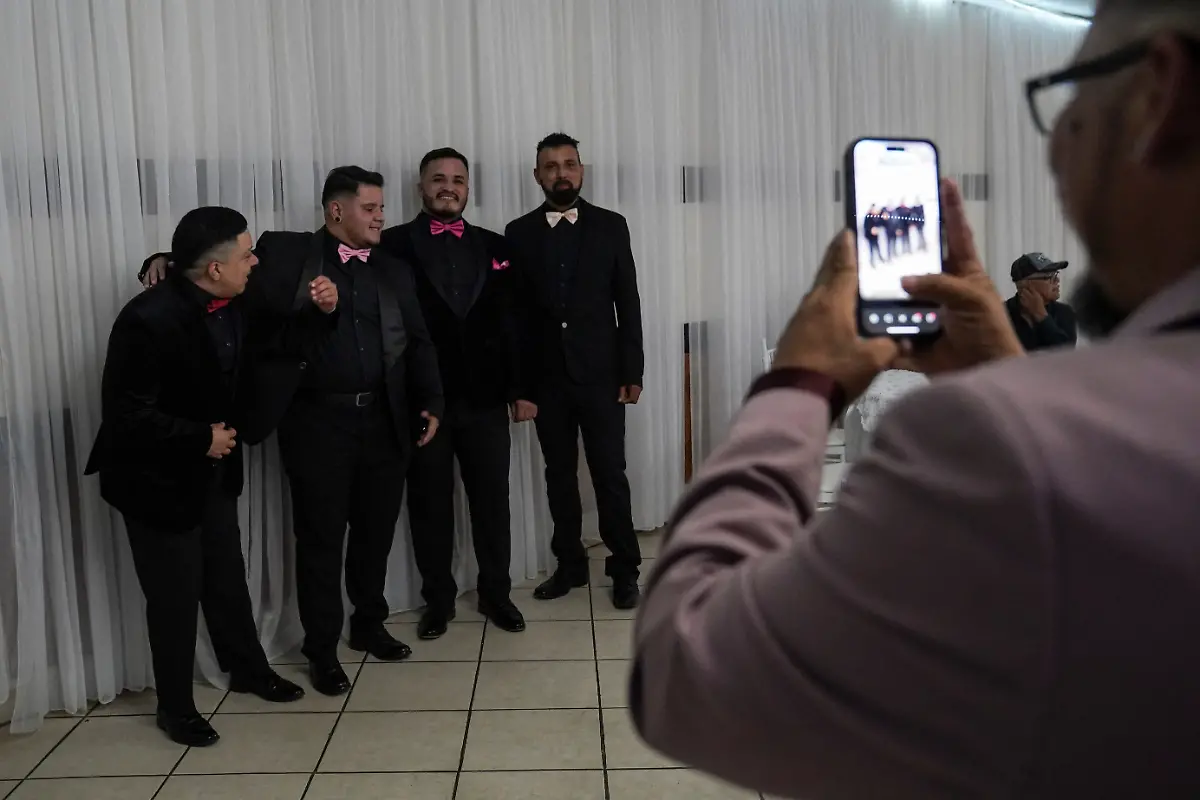From-left-to-right-Valentin-Terrazas-Nicolas-Hurtado-Jorge-L-Euceda-31-and-Jorge-Soto-all-of-whom-are-chambelanes-traditional-male-escorts-pose-for-a-photo-at-a-ballroom-in-Houston-Texas-U-S-May-14-2025-Kassandra-Rivas-51-and-other-transgender-Latina-immigrants-were-recently-able-to-celebrate-this-year-as-quinceaneras-literally-translated-as-15-year-olds-thanks-to-OLTT-Organizacion-Latina-de-Trans-en-Texas-a-group-promoting-rights-for-LGBTQ-people-including-transgender-women-from-Latin-America-Something-inside-me-held-a-longing-to-experience-this-moment-as-a-girl-as-a-15-year-old-Rivas-said-I-imagined-myself-standing-before-the-priest-in-church-wearing-a-dress-like-any-other-woman-REUTERS-Gabriel-V-Cardenas-SEARCH-CARDENAS-U-S-QUINCEANERAS-FOR-THIS-STORY-SEARCH-WIDER-IMAGE-FOR-ALL-STORIES-THIS-IMAGE-IS-ONLY-FOR-USE-WITH-THE-STORY-USA-LGBTQ-QUINCEANERAS-NO-STANDALONE-USES