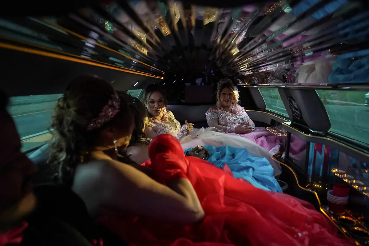 From-left-to-right-Dilian-Quijano-58-Vickymar-Castrellon-54-Jessica-Flores-49-and-Noemi-Martinez-54-ride-in-a-limousine-to-the-ballroom-where-they-will-celebrate-their-quinceanera-in-Houston-Texas-U-S-May-14-2025-Castrellon-and-other-transgender-Latina-immigrants-were-recently-able-to-celebrate-this-year-as-quinceaneras-literally-translated-as-15-year-olds-thanks-to-the-Organizacion-Latina-de-Trans-en-Texas-a-group-promoting-rights-for-LGBTQ-people-including-transgender-women-from-Latin-America-I-never-thought-I-d-get-to-my-50s-said-Castrellon-who-would-sometimes-as-a-teenager-wear-her-friends-quinceanera-gowns-and-pretend-to-be-the-girl-of-honor-It-s-a-dream-I-ve-always-had-and-I-feel-very-happy-because-achieving-it-before-I-leave-this-world-is-something-very-beautiful-for-me-REUTERS-Gabriel-V-Cardenas-SEARCH-CARDENAS-U-S-QUINCEANERAS-FOR-THIS-STORY-SEARCH-WIDER-IMAGE-FOR-ALL-STORIES-THIS-IMAGE-IS-ONLY-FOR-USE-WITH-THE-STORY-USA-LGBTQ-QUINCEANERAS-NO-STANDALONE-USES