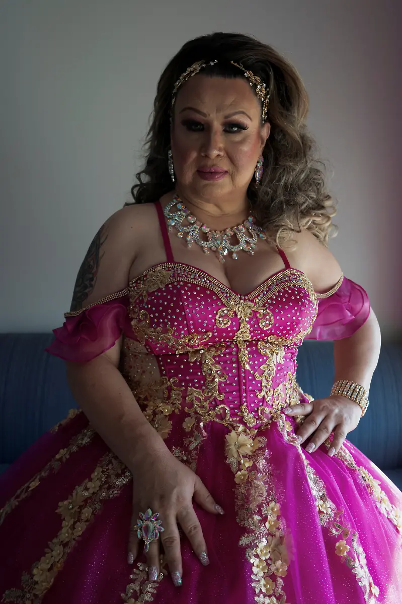 Kassandra-Rivas-51-poses-for-a-photo-in-her-quinceanera-dress-at-a-hotel-in-Houston-Texas-U-S-May-14-2025-Rivas-and-other-transgender-Latina-immigrants-were-recently-able-to-celebrate-this-year-as-quinceaneras-thanks-to-the-Organizacion-Latina-de-Trans-en-Texas-a-group-promoting-rights-for-LGBTQ-people-including-transgender-women-from-Latin-America-Something-inside-me-held-a-longing-to-experience-this-moment-as-a-girl-as-a-15-year-old-Rivas-said-I-imagined-myself-standing-before-the-priest-in-church-wearing-a-dress-like-any-other-woman-REUTERS-Gabriel-V-Cardenas-SEARCH-CARDENAS-U-S-QUINCEANERAS-FOR-THIS-STORY-SEARCH-WIDER-IMAGE-FOR-ALL-STORIES-THIS-IMAGE-IS-ONLY-FOR-USE-WITH-THE-STORY-USA-LGBTQ-QUINCEANERAS-NO-STANDALONE-USES