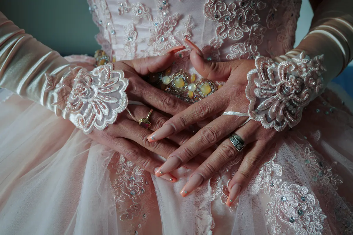 Jessica-Flores-49-poses-for-a-photo-in-her-quinceanera-dress-at-a-hotel-in-Houston-Texas-U-S-May-14-2025-Flores-and-other-transgender-Latina-immigrants-were-recently-able-to-celebrate-this-year-as-quinceaneras-literally-translated-as-15-year-olds-thanks-to-the-Organizacion-Latina-de-Trans-en-Texas-a-group-promoting-rights-for-LGBTQ-people-including-transgender-women-from-Latin-America-I-am-very-excited-I-still-have-that-feeling-from-when-I-was-a-little-girl-that-it-s-going-to-come-true-today-said-Flores-Truly-I-feel-that-excitement-as-if-I-were-fifteen-years-old-REUTERS-Gabriel-V-Cardenas-SEARCH-CARDENAS-U-S-QUINCEANERAS-FOR-THIS-STORY-SEARCH-WIDER-IMAGE-FOR-ALL-STORIES-THIS-IMAGE-IS-ONLY-FOR-USE-WITH-THE-STORY-USA-LGBTQ-QUINCEANERAS-NO-STANDALONE-USES