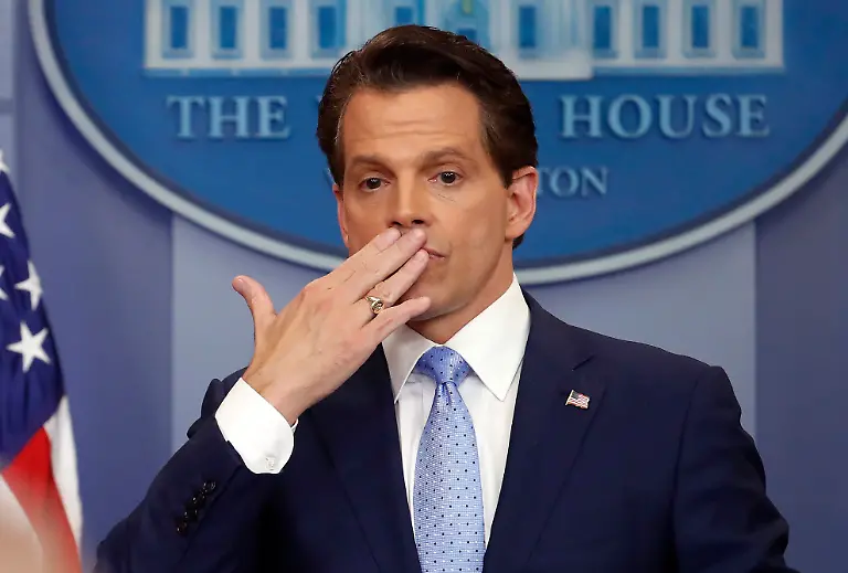 FILE-In-this-July-21-2017-file-photo-Anthony-Scaramucci-right-blows-a-kiss-after-answering-questions-during-the-press-briefing-in-the-Brady-Press-Briefing-room-of-the-White-House-in-Washington-For-an-administration-that-has-spent-2017-throwing-off-headlines-at-a-stunningly-dizzying-pace-the-frenetic-fortnight-in-the-second-half-of-July-reached-an-unparalleled-breakneck-speed-Set-amid-the-backdrop-of-a-president-grappling-with-his-deepest-insecurities-the-West-Wing-s-breakdown-in-policy-collided-with-its-collapse-in-personnel-and-acted-as-a-crucial-inflection-point-for-Donald-Trump-s-first-year-in-office-Scaramucci-stepped-off-the-stage-and-aimed-to-usher-in-a-new-era-for-a-White-House-that-had-been-gripped-with-in-fighting-drowning-in-bad-media-coverage-and-struggling-to-maintain-its-credibility-with-the-public-while-pleasing-a-demanding-audience-of-one-He-lasted-11-days