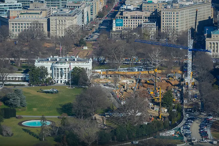 Marine-One-helicopter-is-seen-on-the-South-Lawn-of-the-White-House-to-transport-President-Donald-Trump-to-nearby-Andrews-Air-Force-Base-as-work-continues-on-the-construction-of-the-ballroom-at-the-White-House-Tuesday-Jan-13-2026-in-Washington-where-the-East-Wing-once-stood