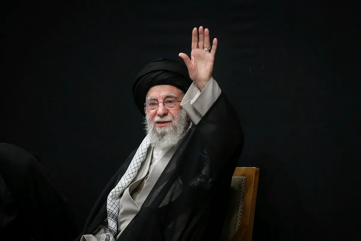 In-this-photo-released-by-the-official-website-of-the-office-of-the-Iranian-supreme-leader-Supreme-Leader-Ayatollah-Ali-Khamenei-waves-to-the-crowd-during-a-ceremony-commemorating-military-personnel-nuclear-scientists-and-other-people-who-were-killed-during-Israeli-airstrikes-in-June-in-Tehran-Iran-Tuesday-July-29-2025