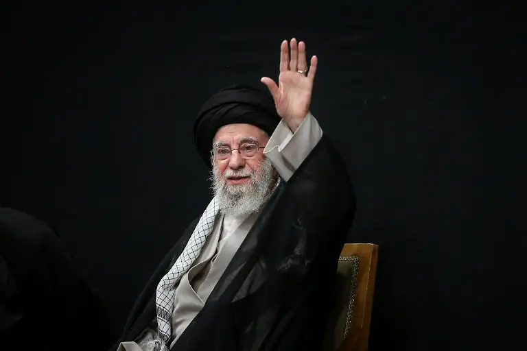 In-this-photo-released-by-the-official-website-of-the-office-of-the-Iranian-supreme-leader-Supreme-Leader-Ayatollah-Ali-Khamenei-waves-to-the-crowd-during-a-ceremony-commemorating-military-personnel-nuclear-scientists-and-other-people-who-were-killed-during-Israeli-airstrikes-in-June-in-Tehran-Iran-Tuesday-July-29-2025