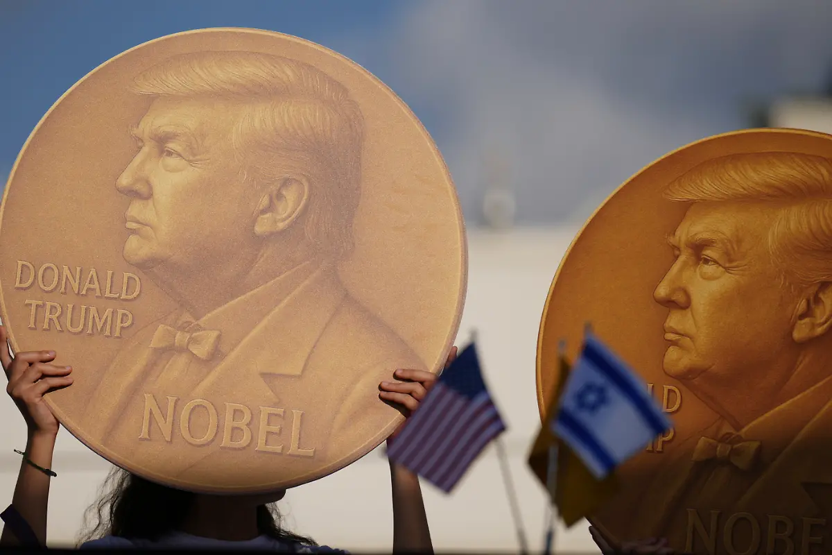 Demonstrators-hold-an-image-of-U-S-President-Donald-Trump-during-a-protest-demanding-the-release-of-Israeli-hostages-who-are-being-held-in-the-Gaza-Strip-outside-the-U-S-Embassy-Branch-Office-in-Tel-Aviv-on-Tuesday-Sept-2-2025