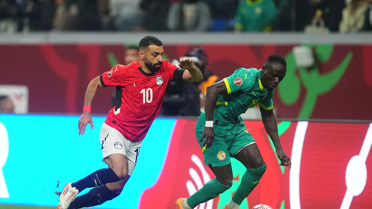 Sadio-Mane-of-Senegal-and-Mohamed-Salah-Mahrous-Ghaly-of-Egypt-battle-for-the-ball-during-the-Semi-final-final-match-between-Senegal-and-Egypt-at-Tangier-Stadium-Tangier-Morocco-on-January-14-2026
