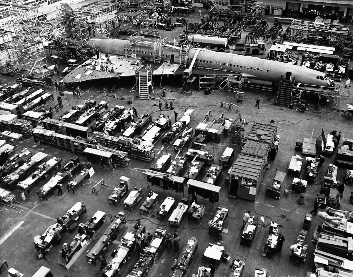 This-overhead-view-shows-the-giant-Anglo-French-supersonic-airliner-Concorde-surrounded-by-its-many-technicians-and-draftsmen-as-it-moves-along-in-the-advance-stage-of-production-at-British-aircraft-corporation-works-in-Bristol-England-Nov-30-1967