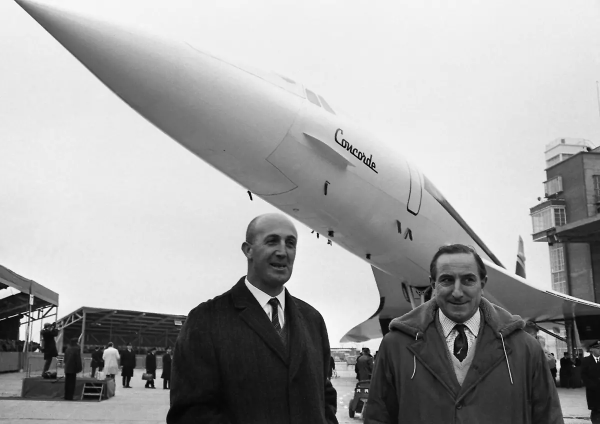 FILE-In-this-Dec-11-1967-file-photo-two-test-pilots-who-will-fly-the-Concorde-the-British-French-supersonic-airliner-Andre-Turcat-of-France-and-left-British-pilot-Brian-Trubshaw-stand-in-front-of-the-prototype-of-the-jet-during-its-roll-out-ceremony-in-Toulouse-France