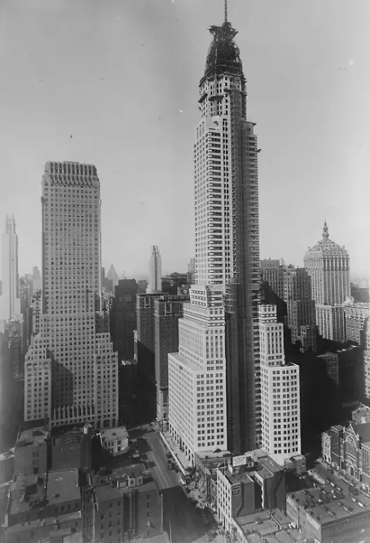 World-s-tallest-building-The-world-s-tallest-building-the-new-Chrysler-building-which-is-nearing-completion-It-is-68-stories-tall-over-808-feet-Left-to-right-above-the-Lefcourt-Colonial-building-the-Chanin-diagonally-across-from-the-Chrysler-at-42-Street-and-Lexington-and-at-tirhgt-the-New-York-Central-the-Paramount-can-be-seen-in-the-distance-to-left-of-centre