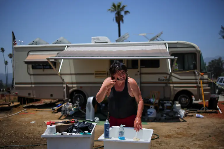 Terry-Kilgore-70-shaves-outside-the-RV-where-he-now-lives-after-losing-his-home-to-the-Eaton-Fire-in-January-2025-at-his-property-in-Altadena-California-U-S-June-27-2025-Kilgore-who-once-played-with-former-Van-Halen-frontman-David-Lee-Roth-says-he-lost-some-of-his-best-guitars-in-the-fire-along-with-an-estimated-120-000-in-equipment-from-his-home-studio-Six-months-after-the-wildfires-that-devastated-the-eastern-and-western-flanks-of-Los-Angeles-Kilgore-s-RV-solution-is-one-way-victims-are-coping-as-the-arduous-rebuilding-effort-goes-on-You-would-never-know-it-but-it-was-pretty-here-It-s-never-going-to-be-pretty-like-it-was-he-said-The-place-I-grew-up-in-is-gone-forever-It-s-a-memory-REUTERS-Daniel-Cole-SEARCH-COLE-ALTADENA-WILDFIRES-FOR-THIS-STORY-SEARCH-WIDER-IMAGE-FOR-ALL-STORIES
