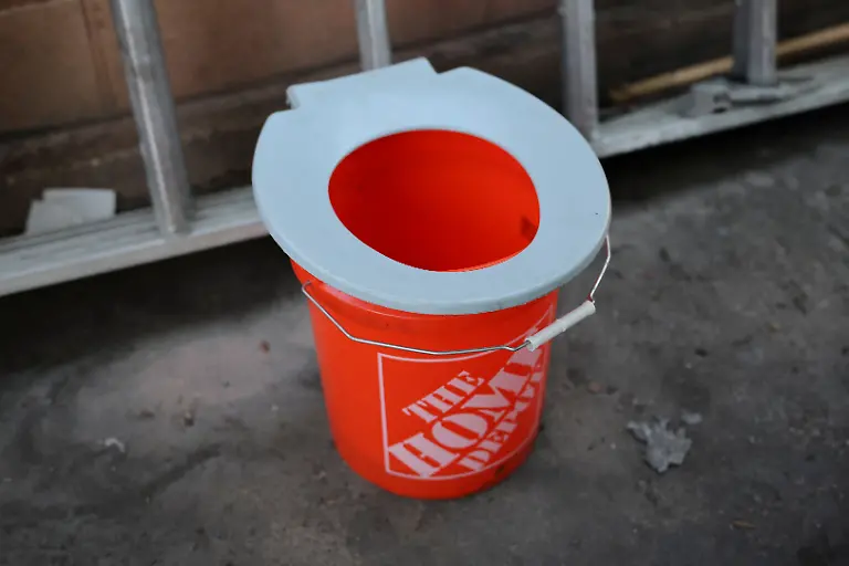 A-makeshift-toilet-is-seen-around-the-back-of-the-RV-where-Terry-Kilgore-70-now-lives-after-losing-his-home-to-the-Eaton-Fire-in-January-2025-at-his-property-in-Altadena-California-U-S-June-27-2025-Kilgore-who-once-played-with-former-Van-Halen-frontman-David-Lee-Roth-says-he-lost-some-of-his-best-guitars-in-the-fire-along-with-an-estimated-120-000-in-equipment-from-his-home-studio-Six-months-after-the-wildfires-that-devastated-the-eastern-and-western-flanks-of-Los-Angeles-Kilgore-s-RV-solution-is-one-way-victims-are-coping-as-the-arduous-rebuilding-effort-goes-on-You-would-never-know-it-but-it-was-pretty-here-It-s-never-going-to-be-pretty-like-it-was-he-said-The-place-I-grew-up-in-is-gone-forever-It-s-a-memory-REUTERS-Daniel-Cole-SEARCH-COLE-ALTADENA-WILDFIRES-FOR-THIS-STORY-SEARCH-WIDER-IMAGE-FOR-ALL-STORIES