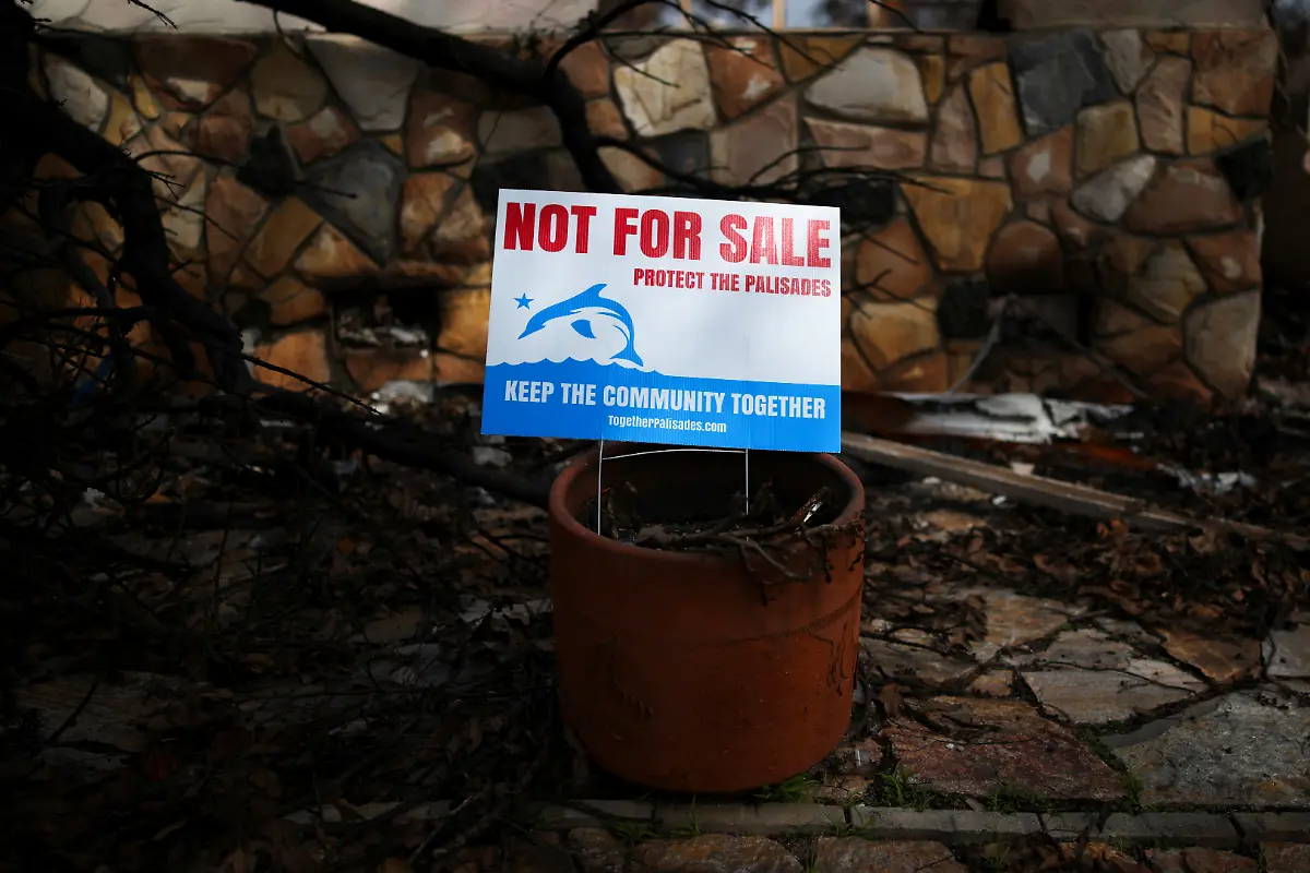 A-sign-sits-on-the-lawn-of-a-destroyed-home-waiting-for-debris-removal-following-the-Palisades-Fire-in-the-Pacific-Palisades-Los-Angeles-California-U-S-March-17-2025