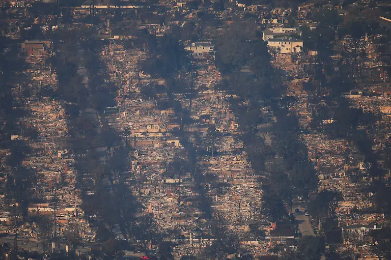 An-aerial-view-shows-debris-from-burned-properties-following-the-Palisades-Fire-at-the-Pacific-Palisades-neighborhood-in-Los-Angeles-California-U-S-January-10-2025