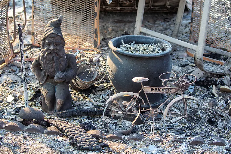 Yard-decoration-items-sit-on-a-structure-damaged-by-the-Eaton-Fire-in-Altadena-California-U-S-January-10-2025