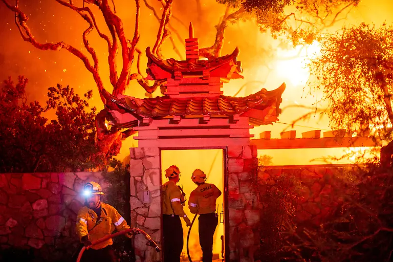 Firefighters-battle-the-Palisades-Fire-as-it-burns-during-a-windstorm-on-the-west-side-of-Los-Angeles-California-U-S-January-8-2025