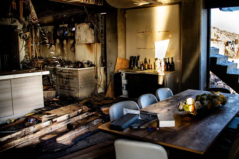 The-burnt-out-kitchen-and-dining-room-of-a-beachfront-Malibu-home-during-the-Palisades-Fire-as-wildfires-continue-to-cause-damage-and-loss-through-the-LA-region-on-January-1-5-2025-in-Los-Angeles-California-The-fires-have-scorched-large-swaths-of-Los-Angeles-as-the-toll-of-destruction-rises-with-entire-neighborhoods-reduced-to-ash