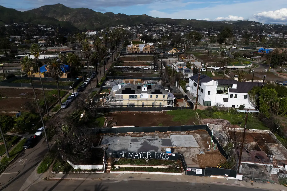 A-drone-view-shows-a-construction-site-in-the-Palisades-with-a-sign-reading-Fire-Mayor-Bass-nearly-a-year-after-wildfires-destroyed-thousands-of-structures-in-the-Los-Angeles-neighborhood-California-U-S-January-6-2026