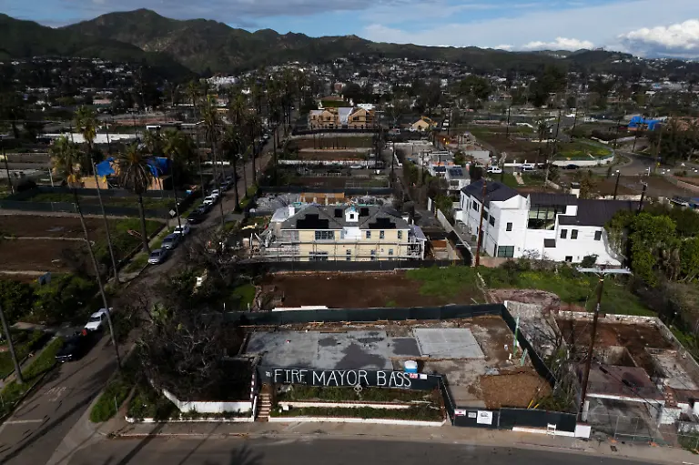 A-drone-view-shows-a-construction-site-in-the-Palisades-with-a-sign-reading-Fire-Mayor-Bass-nearly-a-year-after-wildfires-destroyed-thousands-of-structures-in-the-Los-Angeles-neighborhood-California-U-S-January-6-2026