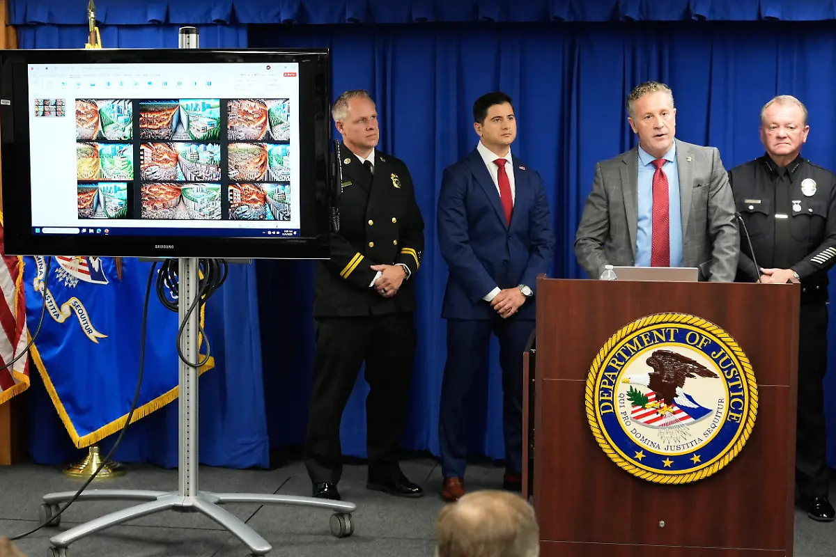 Special-Agent-in-Charge-Kenny-Cooper-of-the-Bureau-of-Alcohol-Tobacco-Firearms-and-Explosives-Los-Angeles-Field-Division-second-from-right-speaks-between-Acting-U-S-Attorney-Bill-Essayli-second-from-left-and-Los-Angeles-Police-Chief-Jim-McDonnell-right-during-a-news-conference-announcing-an-arrest-made-in-the-Palisades-Fire-Wednesday-Oct-8-2025-in-Los-Angeles