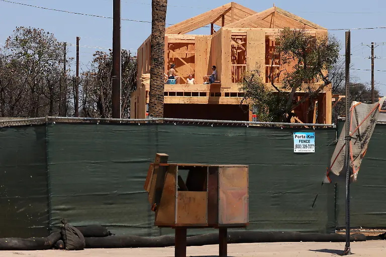 July-4-2025-Los-Angeles-California-USA-A-group-gathers-on-a-home-being-rebuilt-after-being-destroyed-by-the-January-2025-Palisades-fire-in-Pacific-Palisades-California