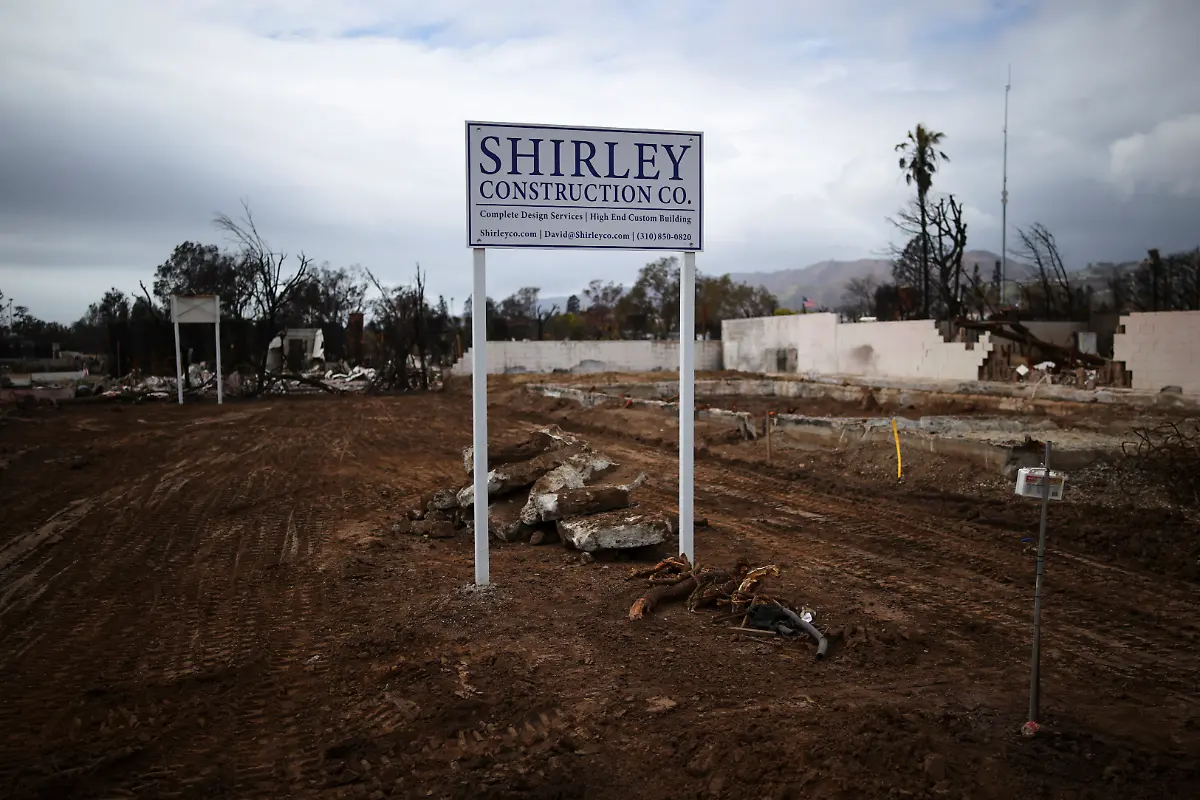 A-sign-advertising-a-construction-company-stands-on-a-plot-of-land-following-the-Palisades-Fire-in-the-Pacific-Palisades-Los-Angeles-California-U-S-March-17-2025