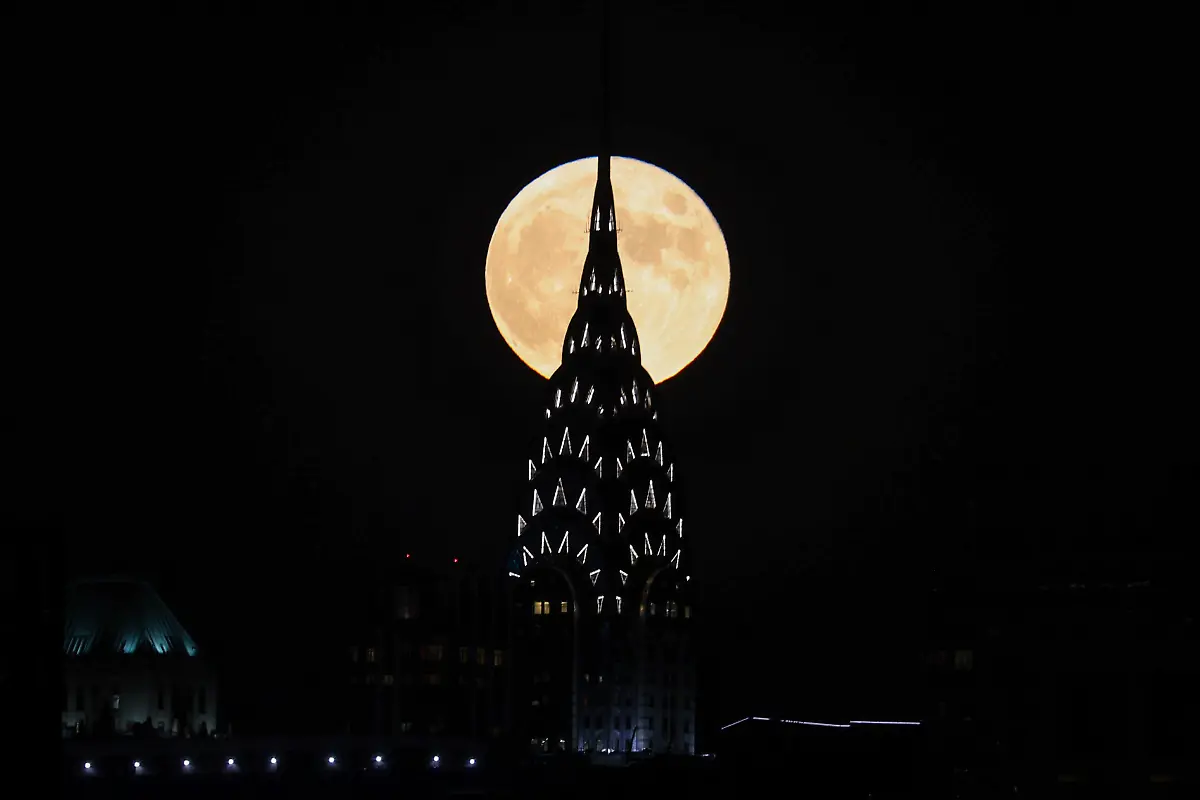 NEW-YORK-NY-OCTOBER-20-Full-moon-also-known-as-Hunter-s-Moon-rises-behind-the-Chrysler-building-in-Manhattan-of-New-York-City-United-States-on-October-20-2021
