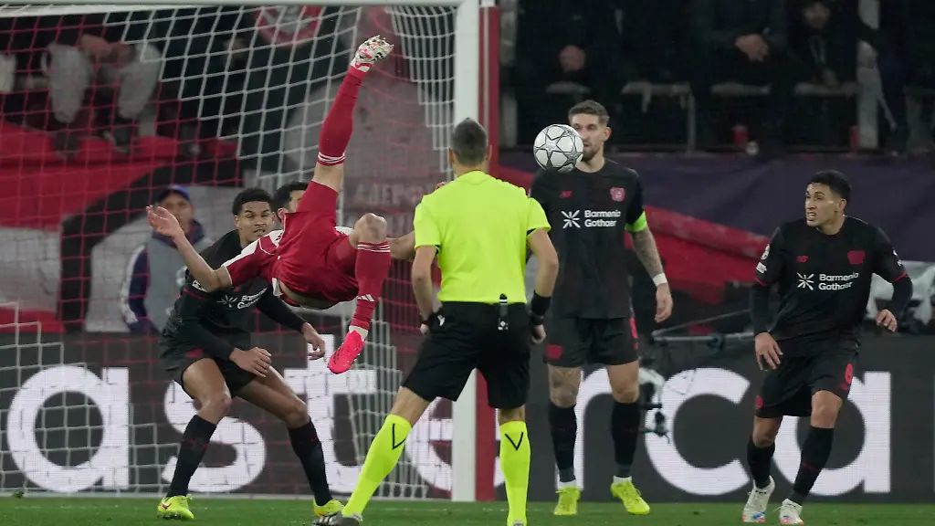 Olympiacos-Mehdi-Taremi-left-tries-to-score-during-the-Champions-League-opening-phase-soccer-match-between-Olympiacos-and-Bayer04-Leverkusen-in-Piraeus-port-near-Athens-Greece-Tuesday-Jan-20-2026