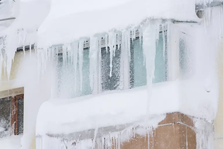 Russia-Weather-9086829-15-01-2026-A-view-shows-a-snow-covered-balcony-in-an-apartment-building-during-a-heavy-snowfall-in-Petropavlovsk-Kamchatsky-Kamchatka-Territory-Russia