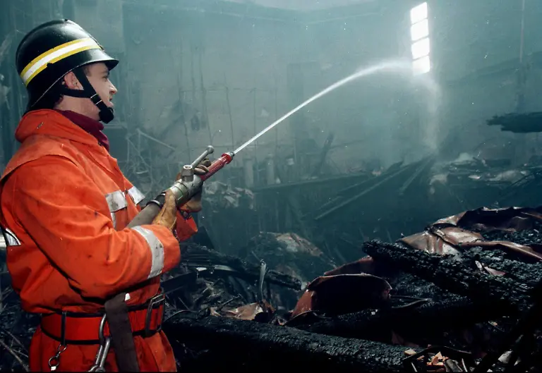 A-firefighter-hoses-down-Tuesday-Jan-30-1996-the-gutted-remains-of-Venice-s-opera-house-La-Fenice-one-of-Italy-s-greatest-artistic-institutions-destroyed-by-a-fire-Monday-night