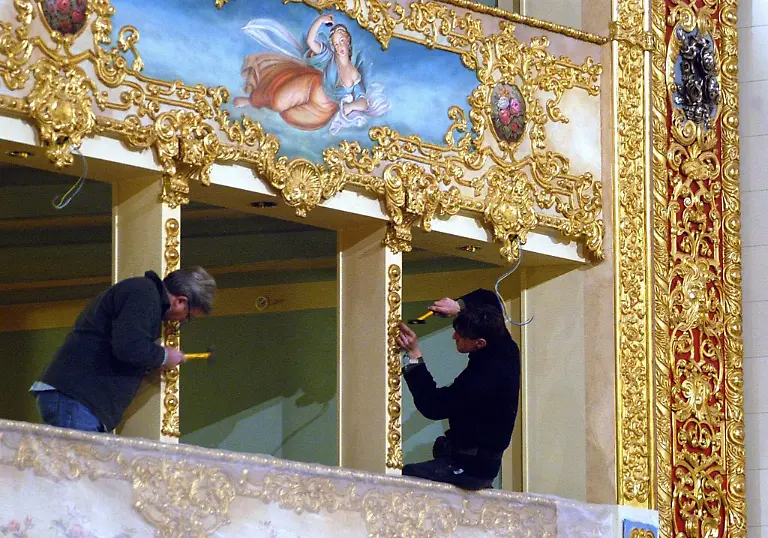 FILES-Undated-picture-shows-two-workers-during-the-restauration-of-the-baroque-stucco-in-one-of-La-Fenice-Theatre-boxes-in-Venice-The-first-inauguration-night-will-be-opened-by-a-Riccardo-Muti-symphony-concert