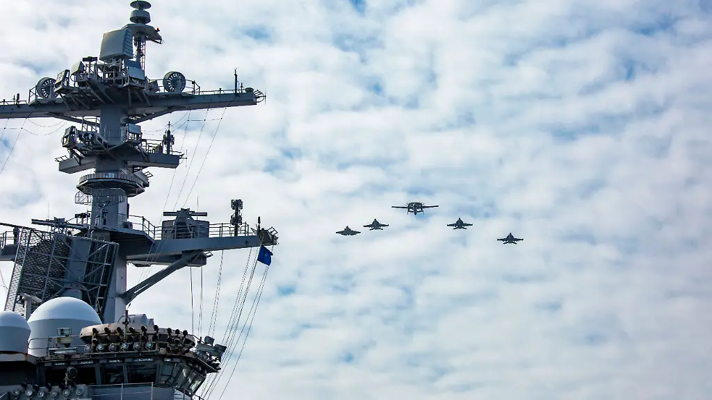 August-23-2025-North-Pacific-Ocean-Aircrafts-attached-to-Carrier-Air-Wing-9-CVW9-fly-over-the-flight-deck-of-the-Nimitz-class-aircraft-carrier-USS-Abraham-Lincoln-CVN-72-during-Northern-Edge-2025-NE25-NE25-is-an-exercise-led-by-U-S-Indo-Pacific-Command-that-serves-as-a-platform-for-joint-multi-domain-operations-to-deliver-high-end-realistic-warfighter-training-strengthen-joint-interoperability-and-sharpen-the-air-and-sea-based-combat-readiness-of-U-S-and-participating-forces-Credit-Image-U-S