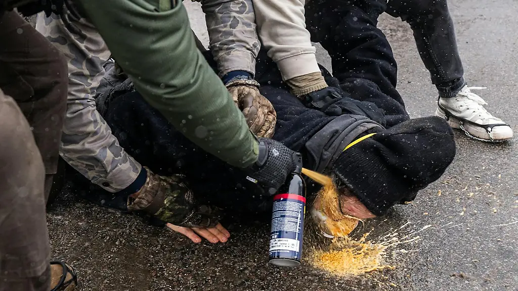 January-21-2026-Federal-agents-pin-a-protester-to-the-ground-and-spray-a-chemical-irritant-directly-into-his-face-at-28th-and-Blaisdell-Avenue-South-in-Minneapolis-on-Jan-21-2026