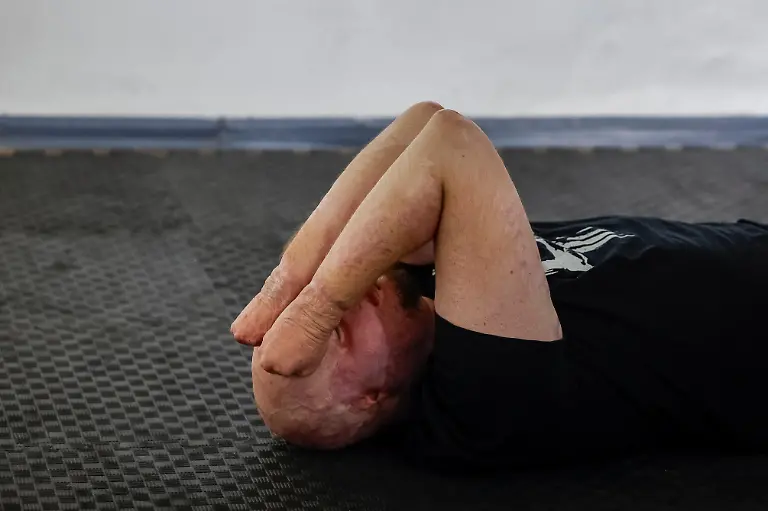 Ukrainian-soldier-Yehor-Babenko-27-who-began-working-as-a-veterans-psychologist-last-year-lies-on-the-floor-before-rehearsing-with-the-Veterans-Theatre-for-an-18th-century-Ukrainian-parody-of-Virgil-s-Aeneid-amid-Russia-s-attack-on-Ukraine-in-Kyiv-Ukraine-September-7-2025-Babenko-was-wounded-in-the-first-year-of-fighting-when-Russian-forces-struck-his-base-in-the-southern-region-of-Mykolaiv-but-that-did-not-stop-him-from-committing-to-months-of-taxing-rehearsals-full-of-dancing-twirling-and-tumbling-He-said-the-transformative-trauma-of-serious-injury-often-compels-people-to-seek-meaning-in-something-new-I-know-a-lot-of-cases-where-people-opened-up-or-tried-things-they-never-dared-to-try-REUTERS-Alina-Smutko-SEARCH-UKRAINE-SMUTKO-THEATRE-FOR-THIS-STORY-SEARCH-WIDER-IMAGE-FOR-ALL-STORIES