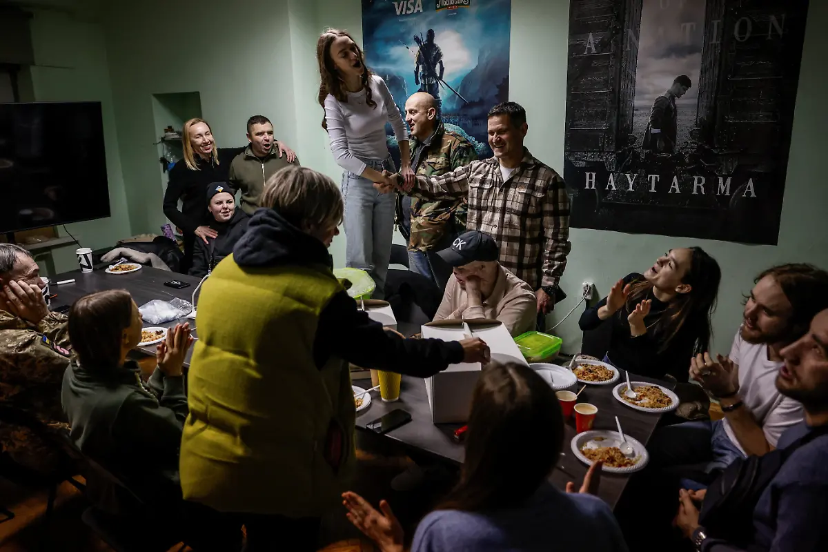 Members-of-the-Veterans-Theatre-group-celebrate-the-birthday-of-founder-Akhtem-Seitablaiev-at-their-rehearsal-place-in-Crimean-House-amid-Russia-s-attack-on-Ukraine-in-Kyiv-Ukraine-December-13-2025-Fellow-member-and-veterans-psychologist-Yehor-Babenko-27-said-the-transformative-trauma-of-serious-injury-often-compels-people-to-seek-meaning-in-something-new-He-said-it-was-critical-for-his-fellow-comrades-to-understand-that-life-does-not-simply-end-after-a-serious-injury-Sometimes-you-understand-it-s-the-opposite-that-it-just-starts-getting-going-REUTERS-Alina-Smutko-SEARCH-UKRAINE-SMUTKO-THEATRE-FOR-THIS-STORY-SEARCH-WIDER-IMAGE-FOR-ALL-STORIES