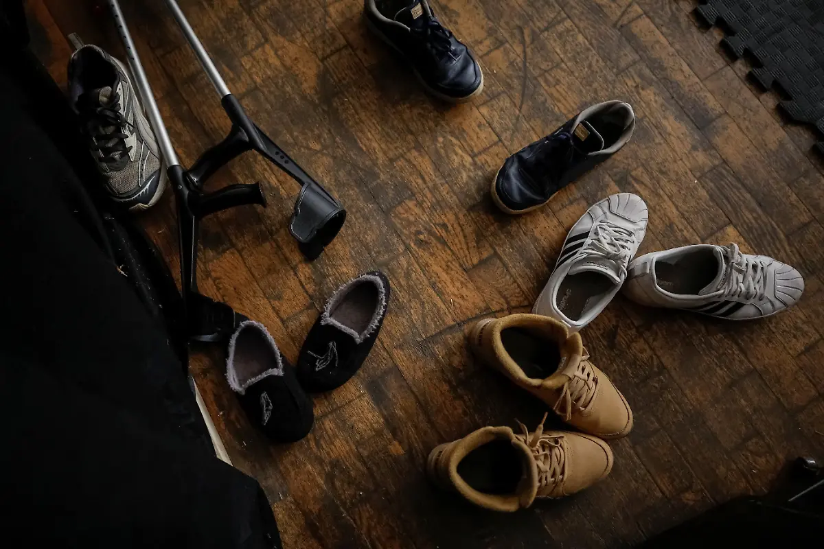 Shoes-and-crutches-belonging-to-members-of-the-Veterans-Theatre-group-lie-on-the-floor-during-rehearsal-of-an-18th-century-Ukrainian-parody-of-Virgil-s-Aeneid-amid-Russia-s-attack-on-Ukraine-in-Kyiv-Ukraine-November-12-2025-Fellow-member-and-veterans-psychologist-Yehor-Babenko-27-said-the-transformative-trauma-of-serious-injury-often-compels-people-to-seek-meaning-in-something-new-He-said-it-was-critical-for-his-fellow-comrades-to-understand-that-life-does-not-simply-end-after-a-serious-injury-Sometimes-you-understand-it-s-the-opposite-that-it-just-starts-getting-going-REUTERS-Alina-Smutko-SEARCH-UKRAINE-SMUTKO-THEATRE-FOR-THIS-STORY-SEARCH-WIDER-IMAGE-FOR-ALL-STORIES