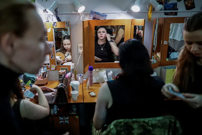 Ukrainian-soldier-and-combat-medic-Inna-Korolenko-26-puts-on-make-up-in-a-dressing-room-before-the-premiere-of-an-18th-century-Ukrainian-parody-of-Virgil-s-Aeneid-performed-by-the-Veterans-Theatre-group-amid-Russia-s-attack-on-Ukraine-in-Kyiv-Ukraine-December-4-2025-Fellow-member-and-veterans-psychologist-Yehor-Babenko-27-said-the-transformative-trauma-of-serious-injury-often-compels-people-to-seek-meaning-in-something-new-He-said-it-was-critical-for-his-fellow-comrades-to-understand-that-life-does-not-simply-end-after-a-serious-injury-Sometimes-you-understand-it-s-the-opposite-that-it-just-starts-getting-going-REUTERS-Alina-Smutko-SEARCH-UKRAINE-SMUTKO-THEATRE-FOR-THIS-STORY-SEARCH-WIDER-IMAGE-FOR-ALL-STORIES