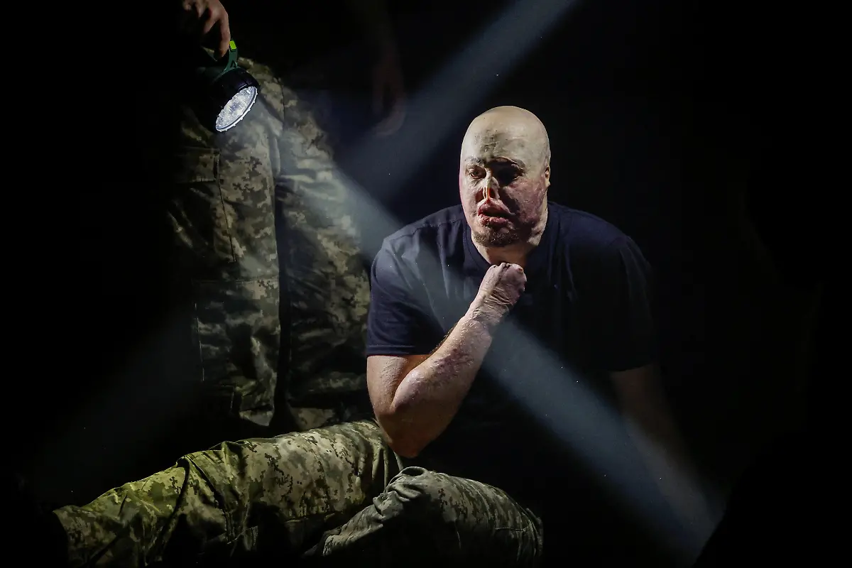 Ukrainian-soldier-Yehor-Babenko-27-who-began-working-as-a-veterans-psychologist-last-year-performs-at-the-premiere-of-an-18th-century-Ukrainian-parody-of-Virgil-s-Aeneid-performed-by-the-Veterans-Theatre-group-amid-Russia-s-attack-on-Ukraine-in-Kyiv-Ukraine-December-4-2025-Babenko-was-wounded-in-the-first-year-of-fighting-when-Russian-forces-struck-his-base-in-the-southern-region-of-Mykolaiv-but-that-did-not-stop-him-from-committing-to-months-of-taxing-rehearsals-full-of-dancing-twirling-and-tumbling-He-said-said-the-transformative-trauma-of-serious-injury-often-compels-people-to-seek-meaning-in-something-new-I-know-a-lot-of-cases-where-people-opened-up-or-tried-things-they-never-dared-to-try-REUTERS-Alina-Smutko-SEARCH-UKRAINE-SMUTKO-THEATRE-FOR-THIS-STORY-SEARCH-WIDER-IMAGE-FOR-ALL-STORIES