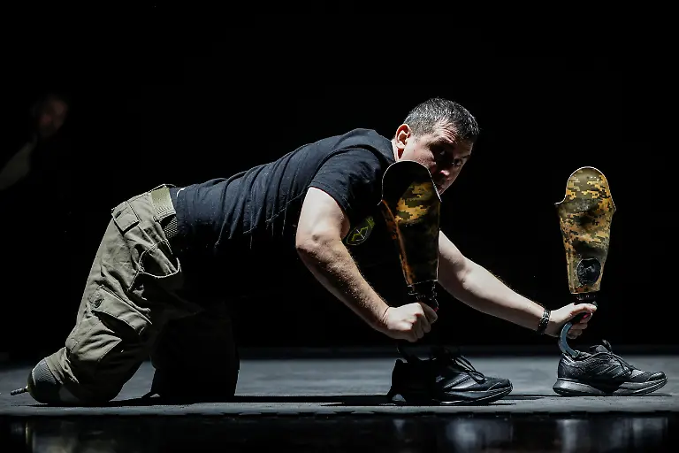 Ukrainian-soldier-Artem-Moroz-46-who-lost-both-legs-rehearses-with-the-Veterans-Theatre-before-the-premiere-of-an-18th-century-Ukrainian-parody-of-Virgil-s-Aeneid-amid-Russia-s-attack-on-Ukraine-in-Kyiv-Ukraine-December-4-2025-Fellow-member-and-veterans-psychologist-Yehor-Babenko-27-said-the-transformative-trauma-of-serious-injury-often-compels-people-to-seek-meaning-in-something-new-He-said-it-was-critical-for-his-fellow-comrades-to-understand-that-life-does-not-simply-end-after-a-serious-injury-Sometimes-you-understand-it-s-the-opposite-that-it-just-starts-getting-going-REUTERS-Alina-Smutko-SEARCH-UKRAINE-SMUTKO-THEATRE-FOR-THIS-STORY-SEARCH-WIDER-IMAGE-FOR-ALL-STORIES