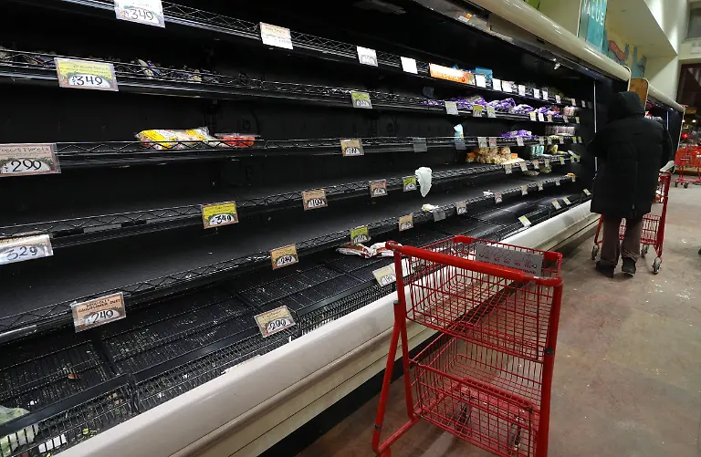 NEW-YORK-UNITED-STATES-JANUARY-23-People-shop-at-a-supermarket-as-shelves-are-left-empty-ahead-of-the-arctic-blast-and-snowstorm-expected-to-sweep-through-the-country-this-weekend-with-extreme-cold-and-blankets-of-ice-in-New-York-City-United-States-on-January-23-2026