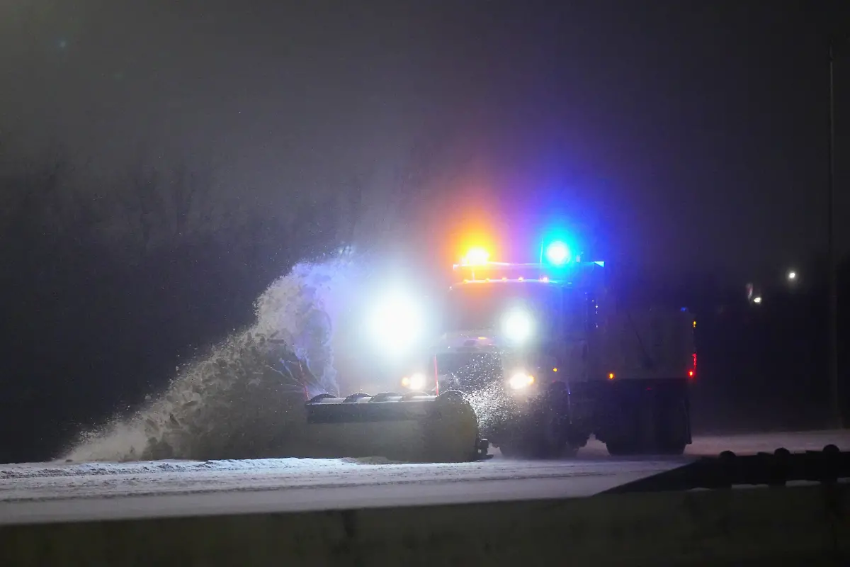 A-truck-plows-the-eastbound-lanes-of-Interstate-20-during-a-snow-storm-Saturday-Jan-24-2026-in-Grand-Prairie-Texas
