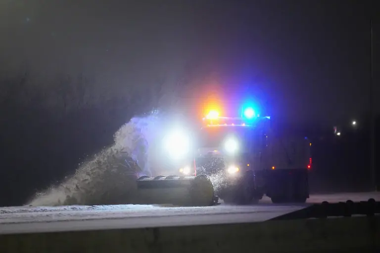 A-truck-plows-the-eastbound-lanes-of-Interstate-20-during-a-snow-storm-Saturday-Jan-24-2026-in-Grand-Prairie-Texas