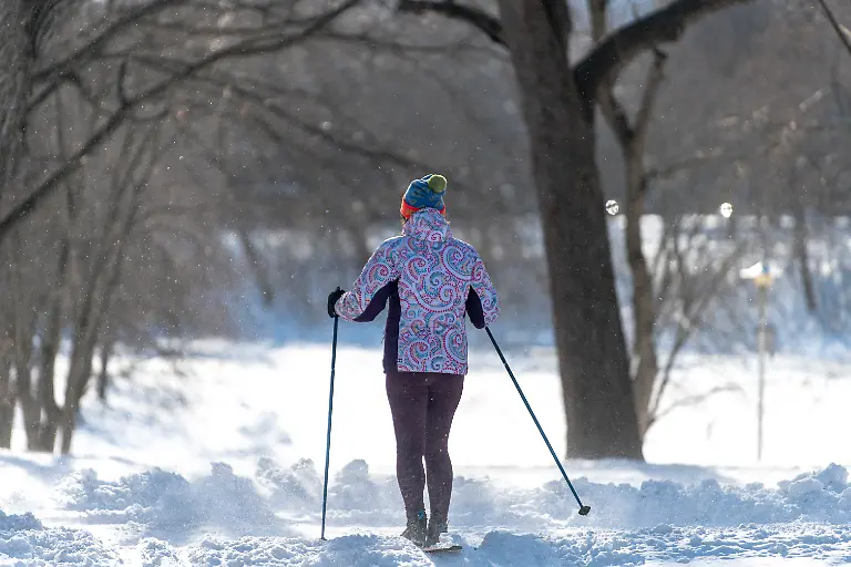 A-person-skis-amid-snow-covered-trails-in-Parc-La-Fontaine-in-Montreal-Quebec-Canada-on-January-23-2026-Environment-Canada-issued-a-warning-that-temperatures-could-dip-below-20-C-4-F-overnight-with-winds-expected-to-persist-until-January-24-and-wind-chill-values-near-35-C-31-F-overnight-and-early-on-January-24-as-a-polar-vortex-descends-on-Canada-and-parts-of-the-United-States