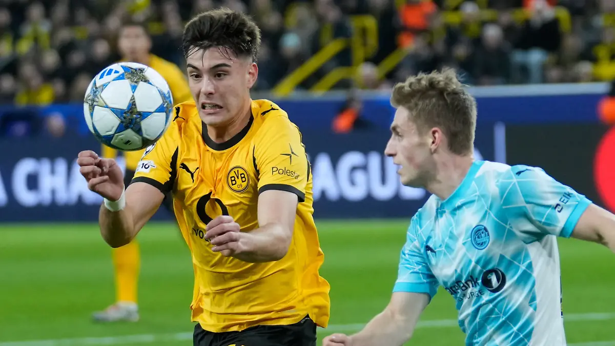 Dortmund-s-Aaron-Anselmino-fights-for-the-ball-against-Glimt-s-Fredrik-Sjovold-during-the-Champions-League-opening-phase-soccer-match-between-Borussia-Dortmund-and-Bodo-Glimt-in-Dortmund-Germany-Wednesday-Dec-10-2025