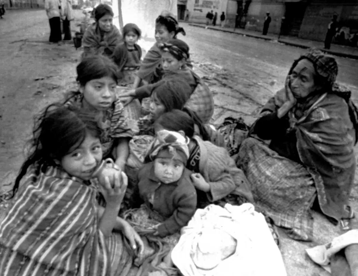 An-elderly-woman-and-some-children-sit-on-a-street-in-Guatemala-City-on-Feb-5-1976-after-their-home-was-destroyed-in-an-earthquake