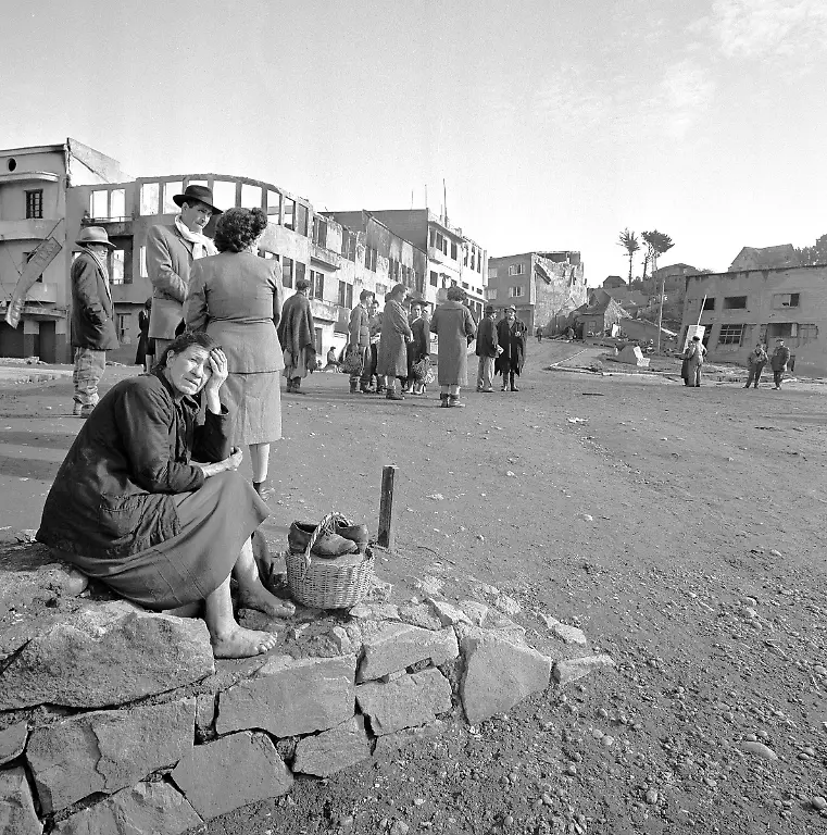 The-tragedy-of-the-earthquake-is-mirrored-in-the-face-of-a-barefoot-woman-sitting-on-a-rock-wall-in-Castro-Chile-May-30-1960-Few-homes-escaped-destruction-in-this-town-of-10-000-persons-AP-Photo-William-J